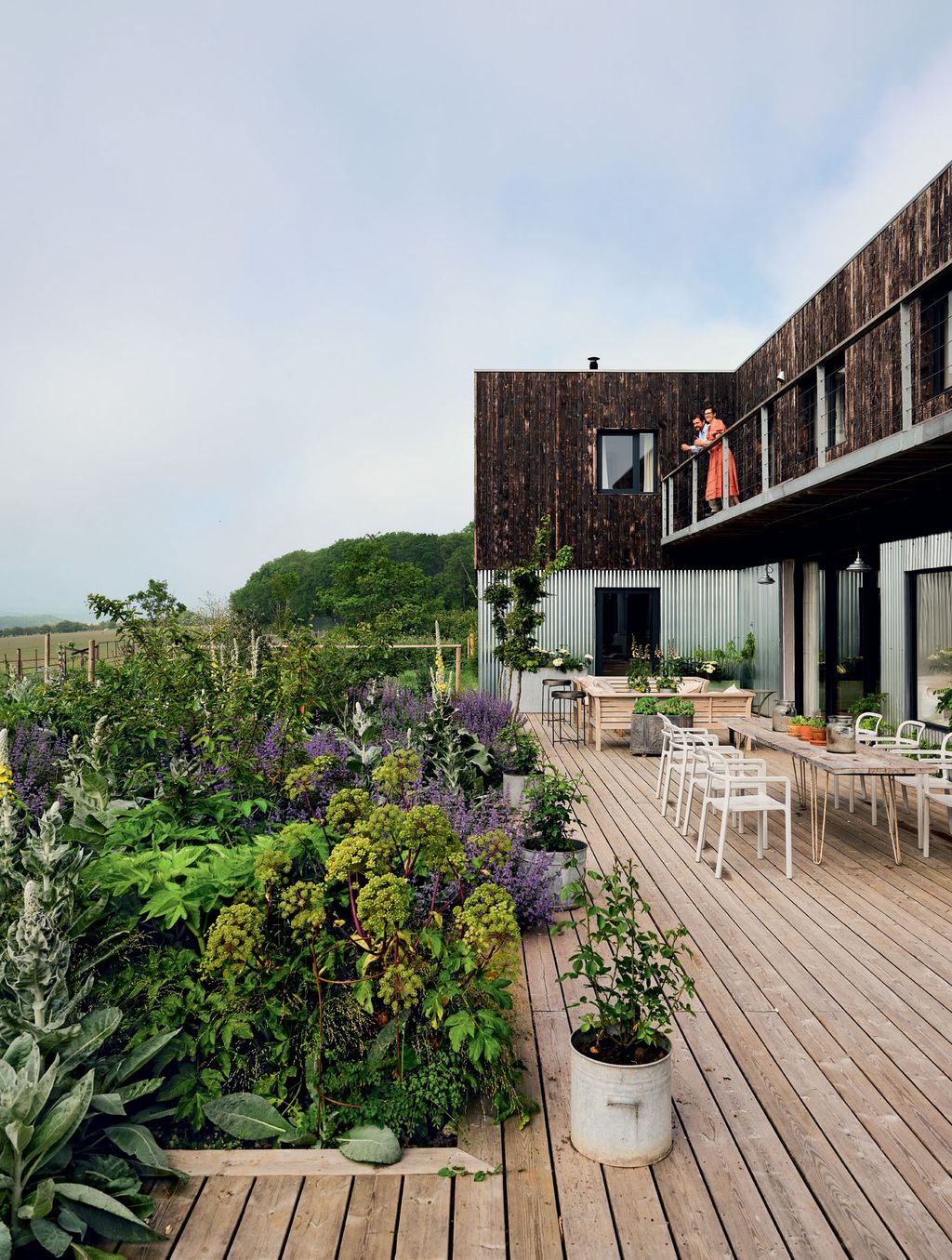 Image may contain Terrace Patio Human Person Porch Vase Plant Pottery Potted Plant and Jar