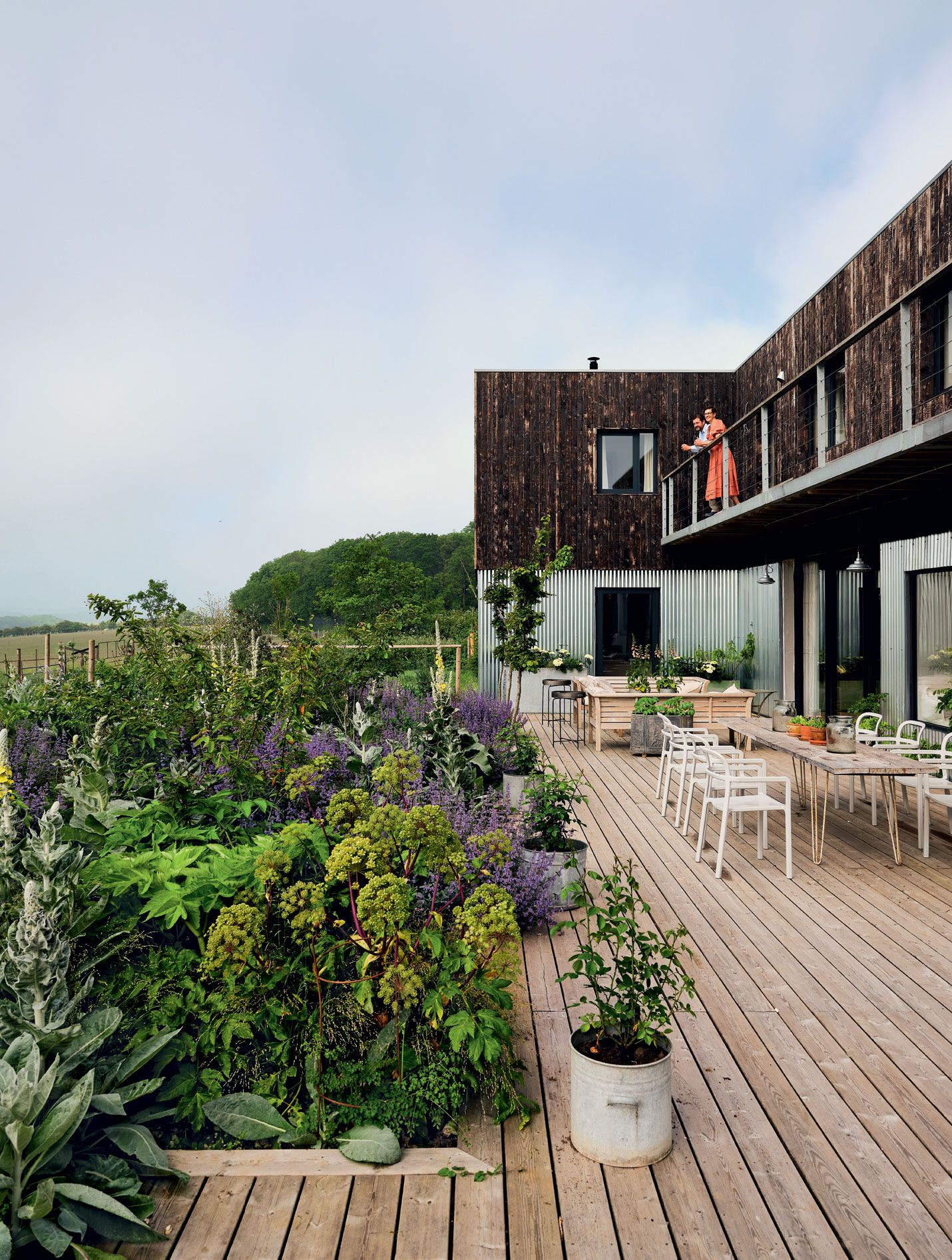 Image may contain Terrace Patio Human Person Porch Vase Plant Pottery Potted Plant and Jar