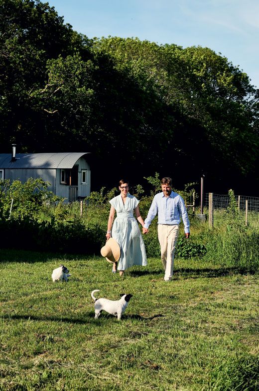 Image may contain Clothing Apparel Plant Grass Human Person Fashion Robe Dress Gown Wedding Outdoors and Lawn