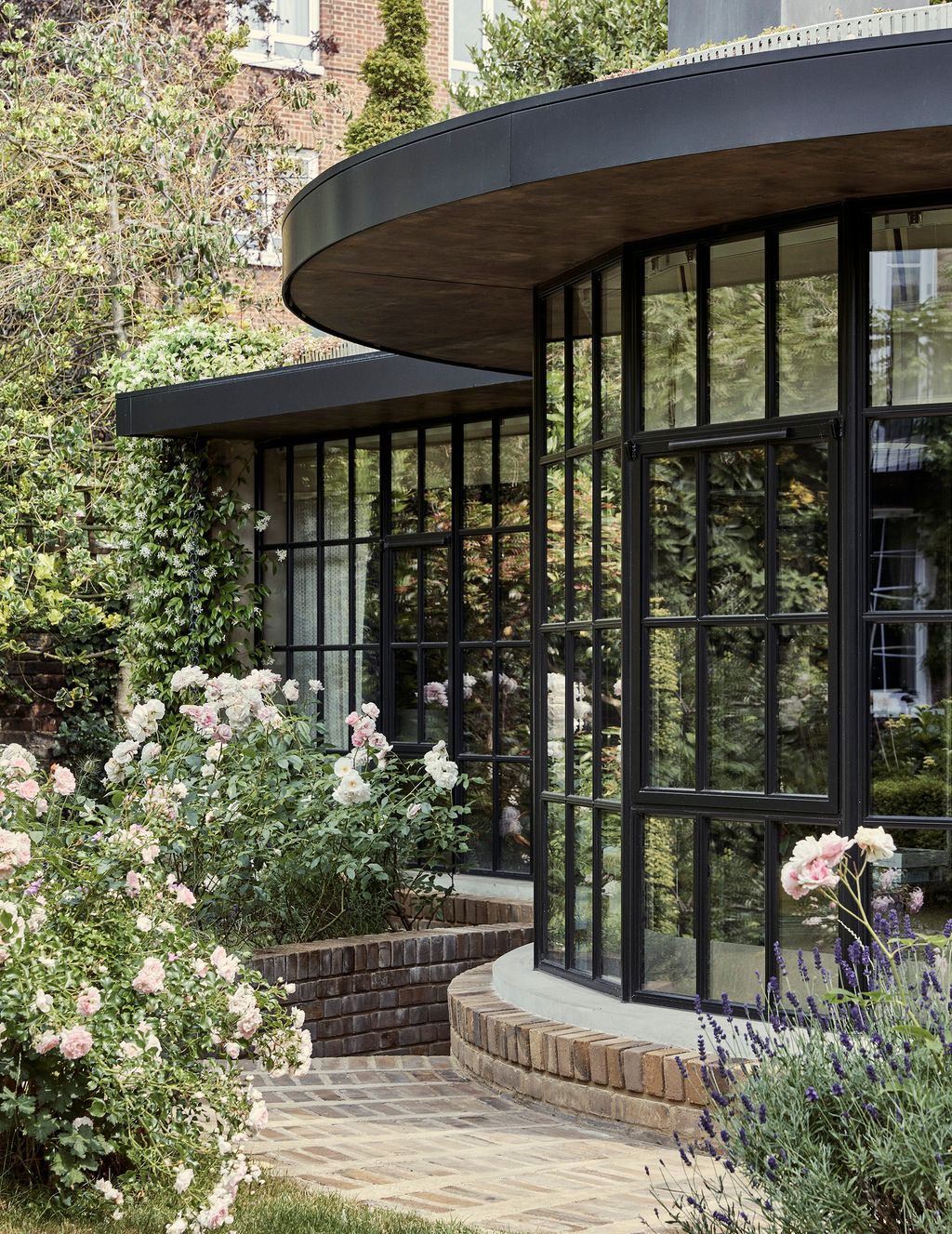 Image may contain Outdoors Porch Patio Garden Plant Arbour Flower and Blossom