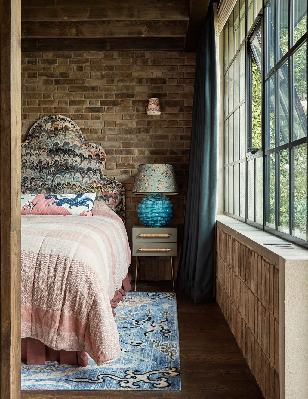 Image may contain Indoors Room Bedroom Furniture Bed Dorm Room and Wood