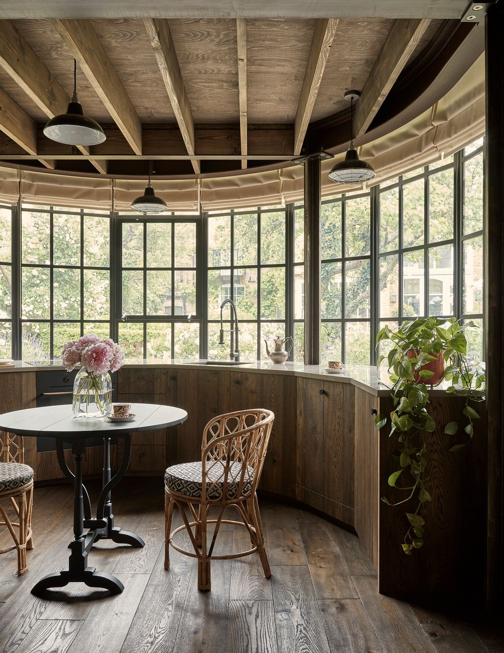 Image may contain Furniture Indoors Room Table and Plant