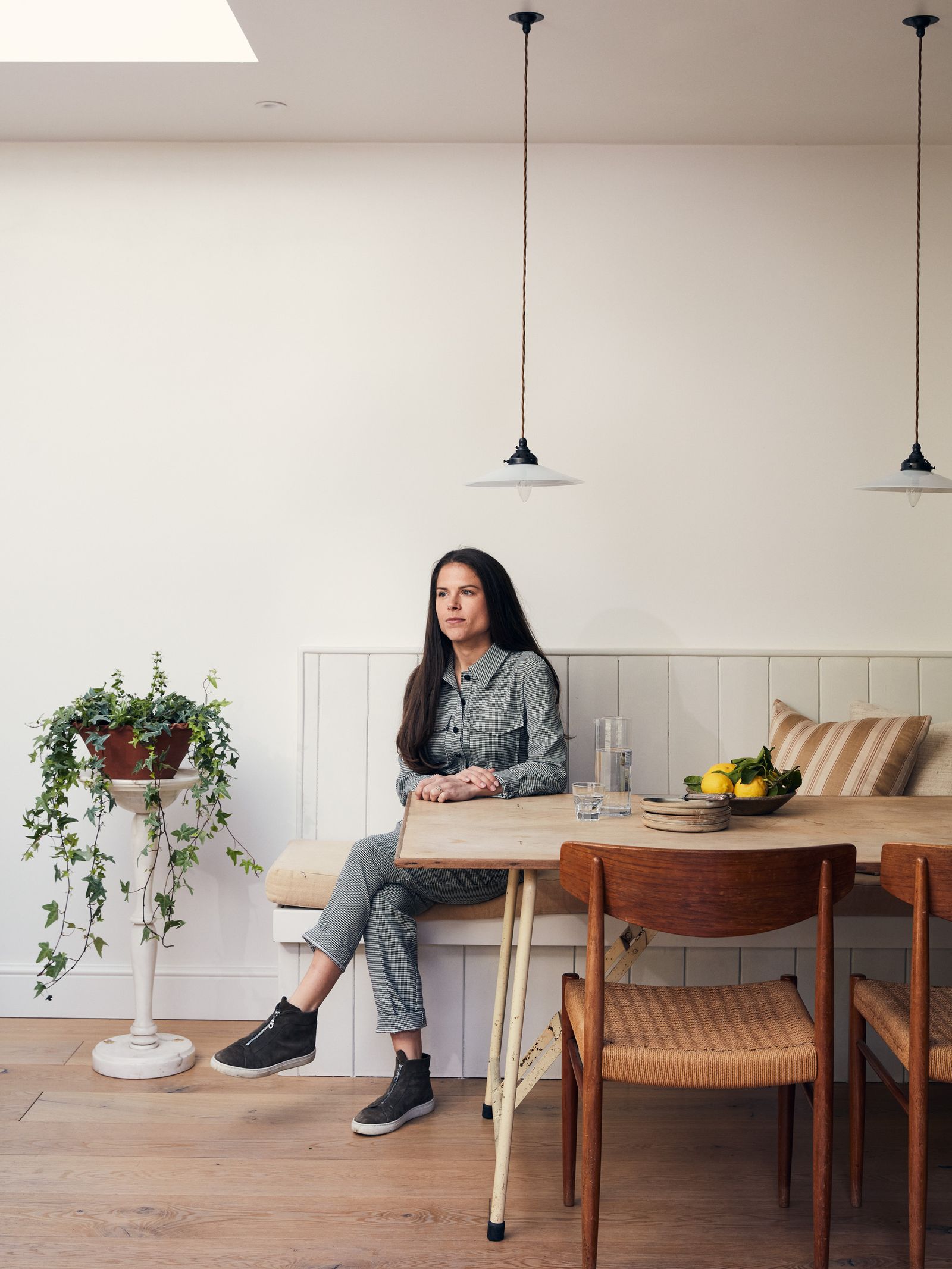Thea Speke in the dining area her basement flat in London.