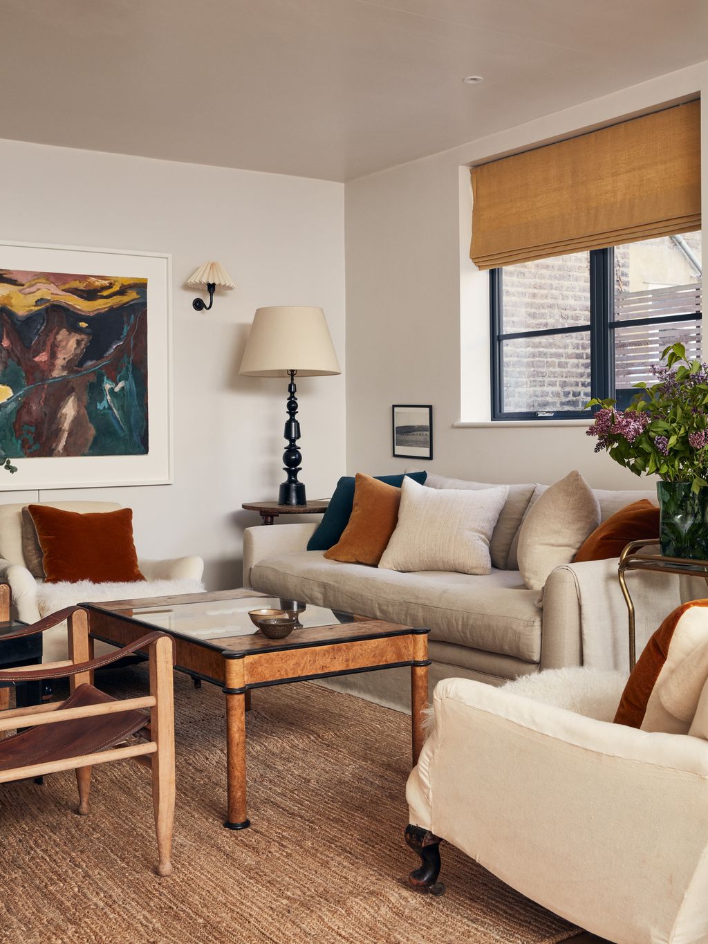 Image may contain Home Decor Furniture Living Room Room Indoors Chair Interior Design Table Couch and Coffee Table