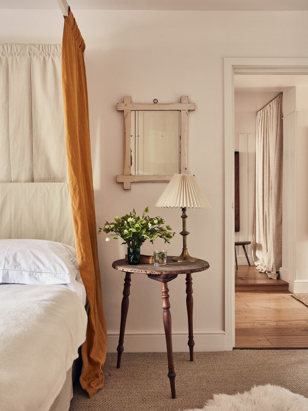 Image may contain Wood Flooring Floor Furniture Bed Interior Design Indoors Hardwood Lamp Table Lamp and Room