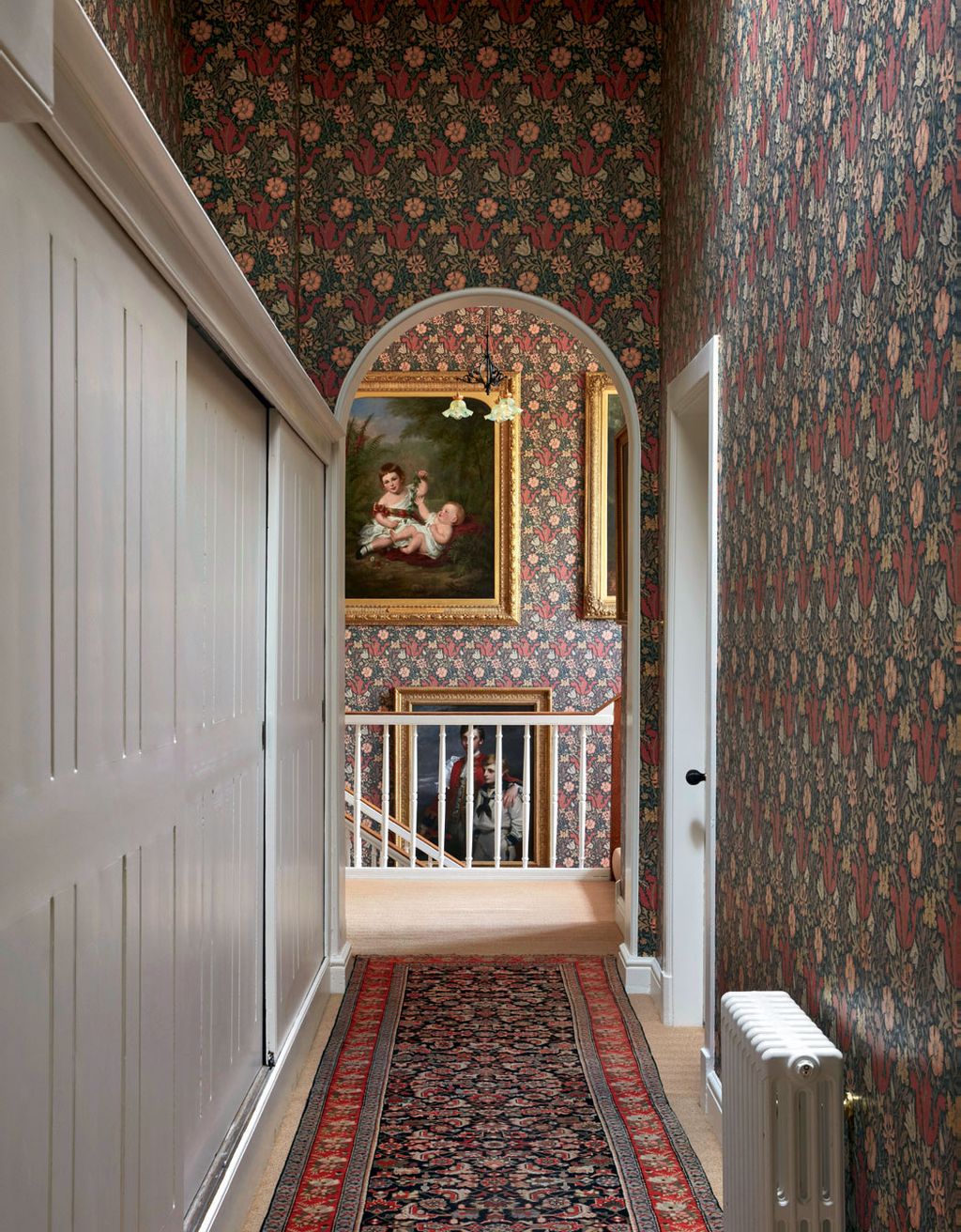 Image may contain Flooring Human Person Corridor Floor Banister and Handrail