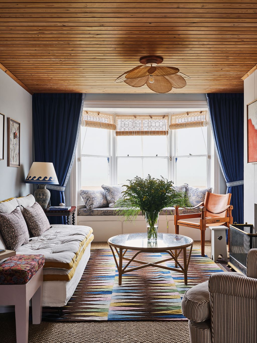 Image may contain Furniture Home Decor Table Coffee Table Rug Living Room Indoors Room Interior Design and Couch