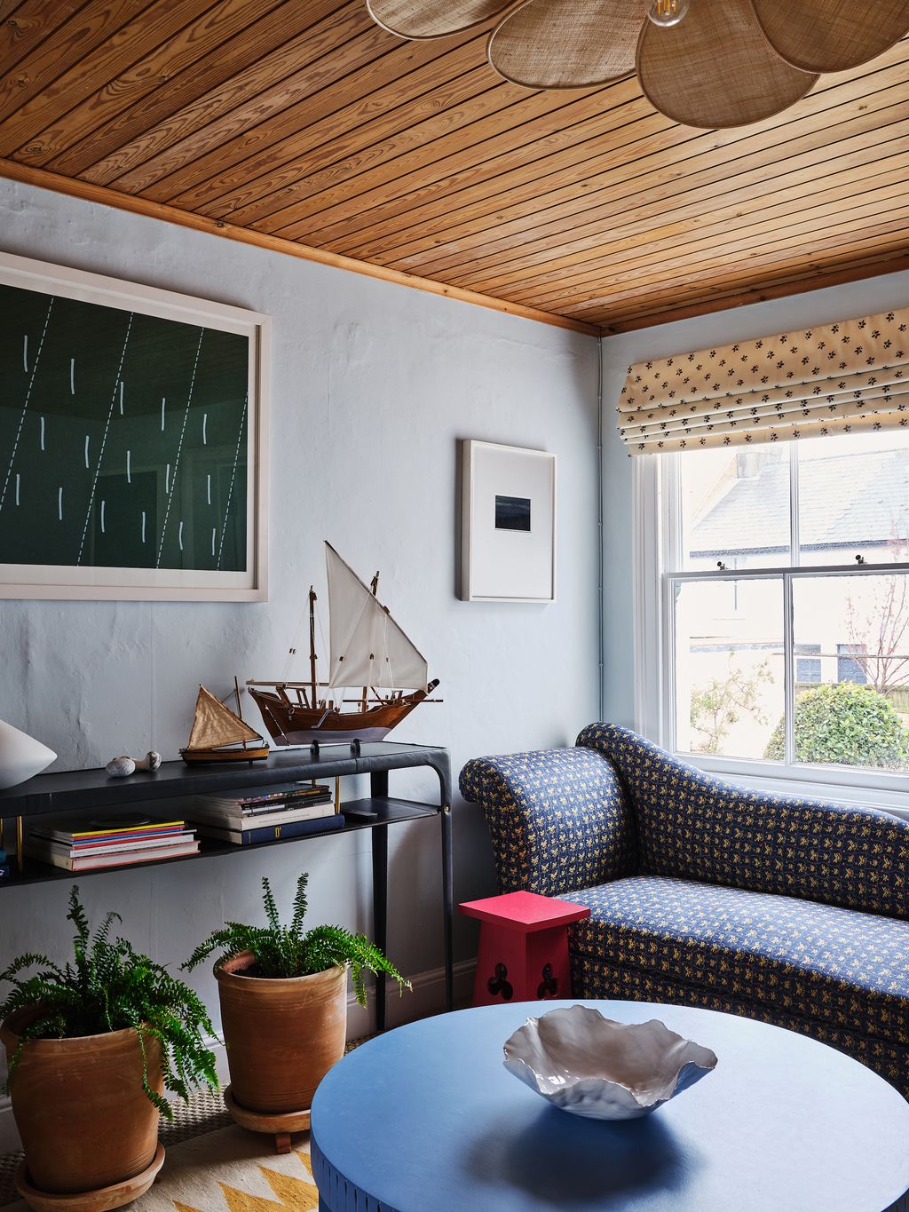 Image may contain Furniture Living Room Indoors Room Couch Interior Design and Table