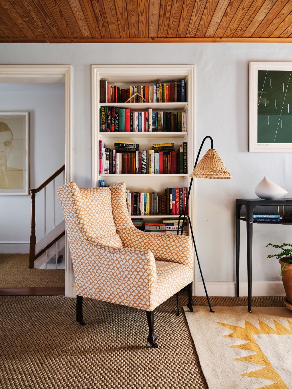 Image may contain Furniture Chair Bookcase Living Room Indoors Room Shelf Home Decor and Interior Design