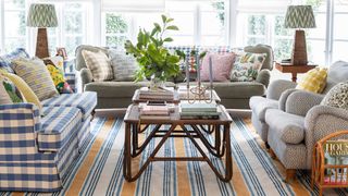 Image may contain Furniture Table Coffee Table Living Room Room Indoors Chair Tabletop Couch Home Decor and Rug