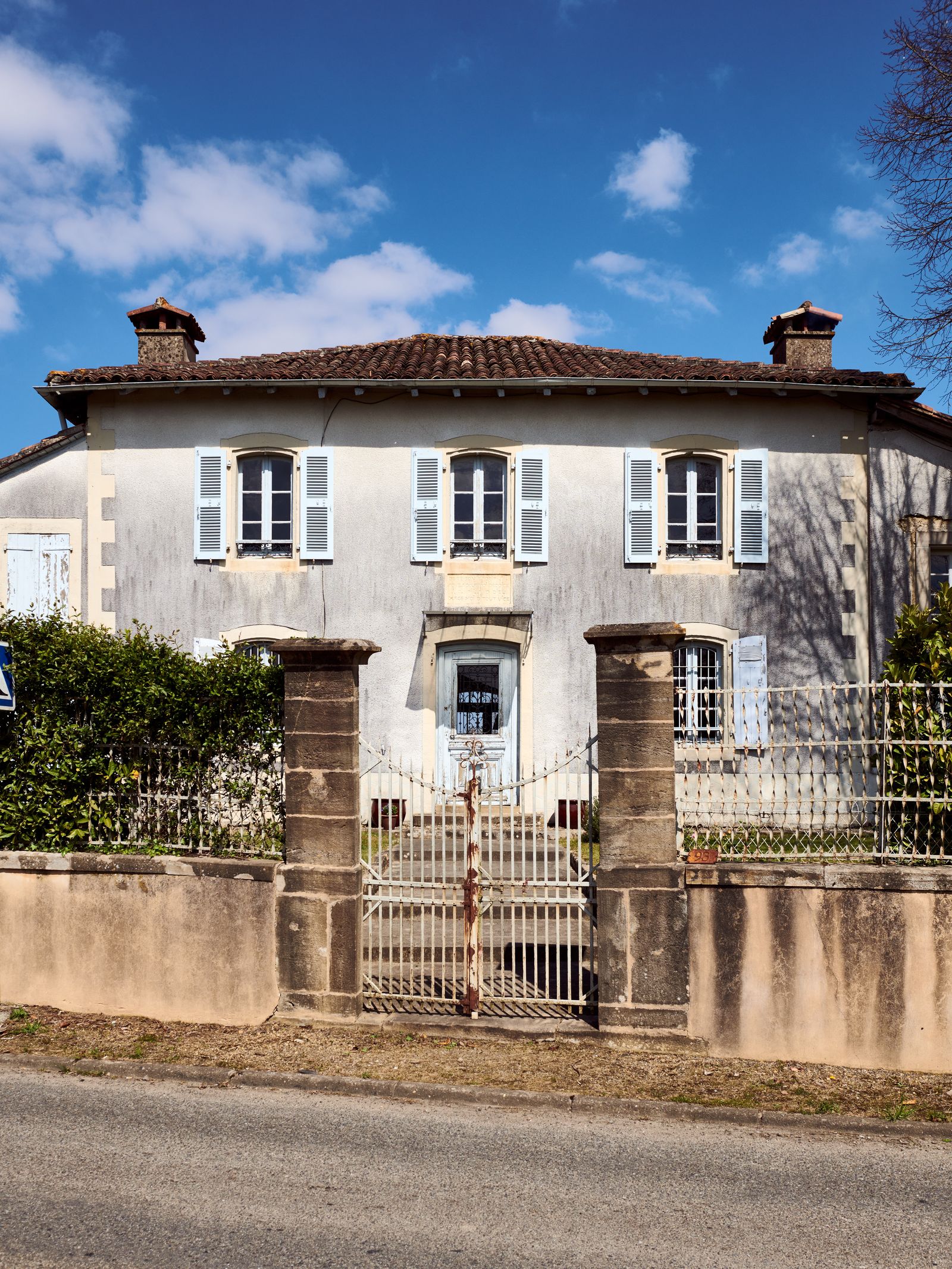 Image may contain Building Housing Villa House and Gate