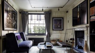 Image may contain Furniture Living Room Indoors Room Couch Table Building Housing Coffee Table and Interior Design