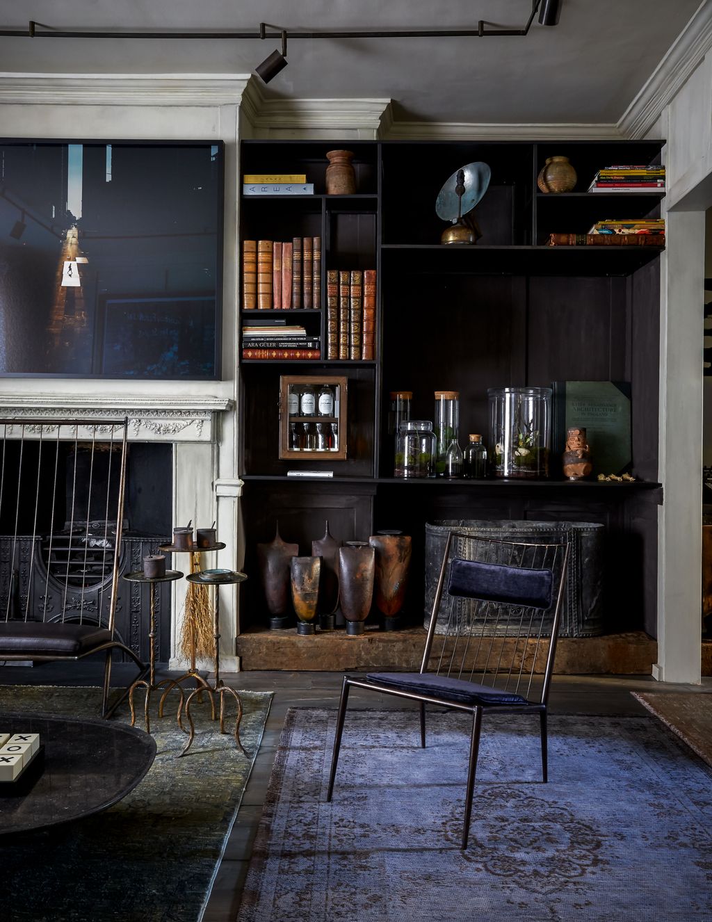 Image may contain Furniture Shelf Chair Interior Design Indoors Living Room Room Bookcase Electronics and Screen