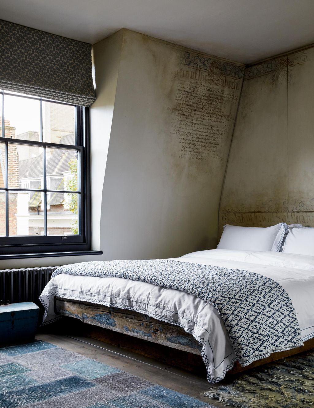 Image may contain Indoors Room Bedroom Furniture Bed Building Housing and Rug