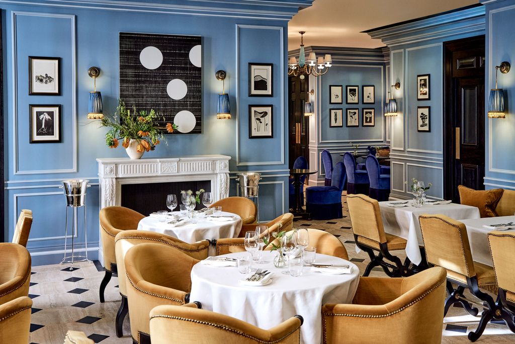 Image may contain Furniture Chair Restaurant Interior Design Indoors Room Home Decor and Living Room