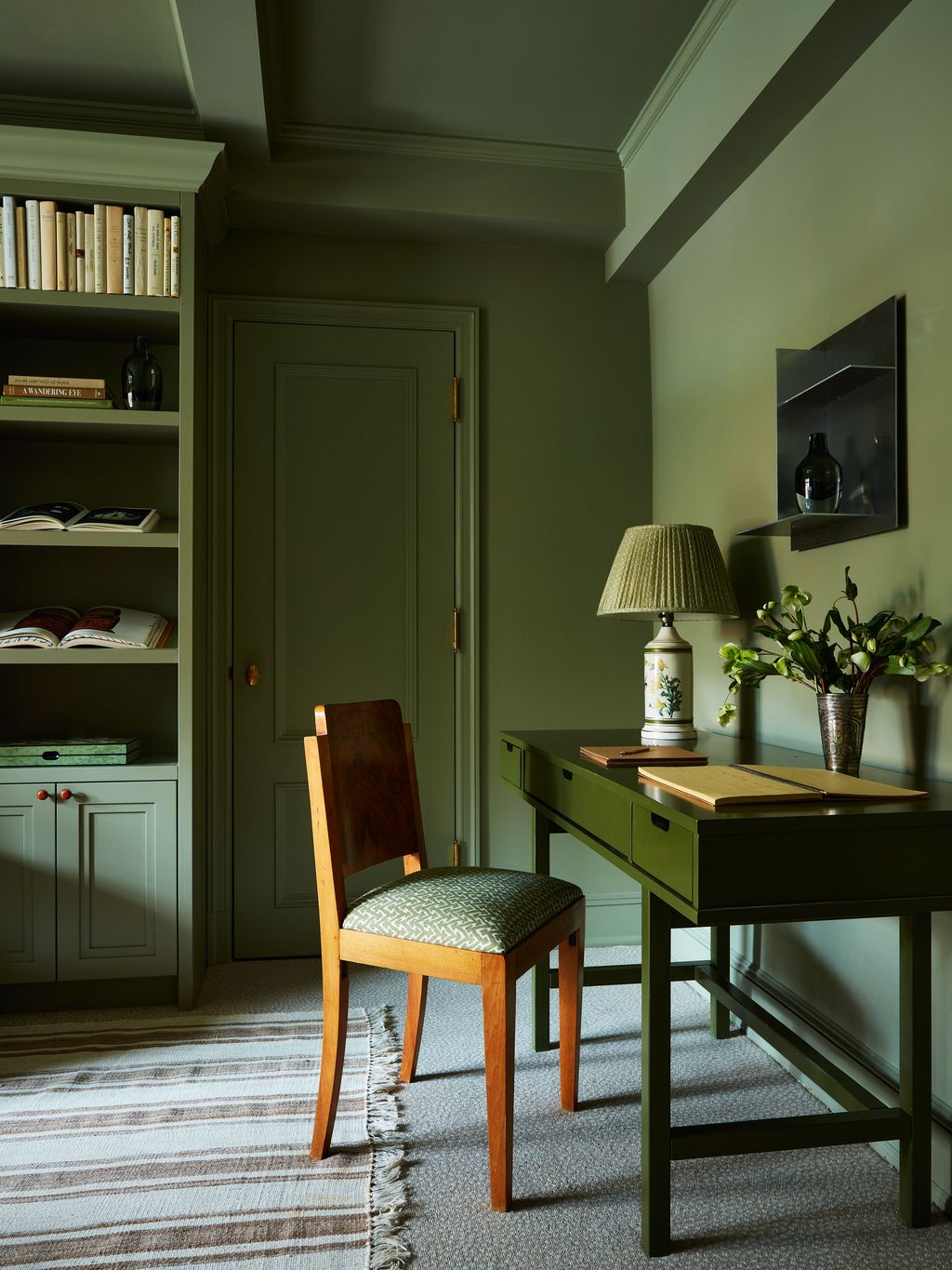 Image may contain Furniture Chair Shelf Wood Lamp Table Lamp Hardwood and Flooring