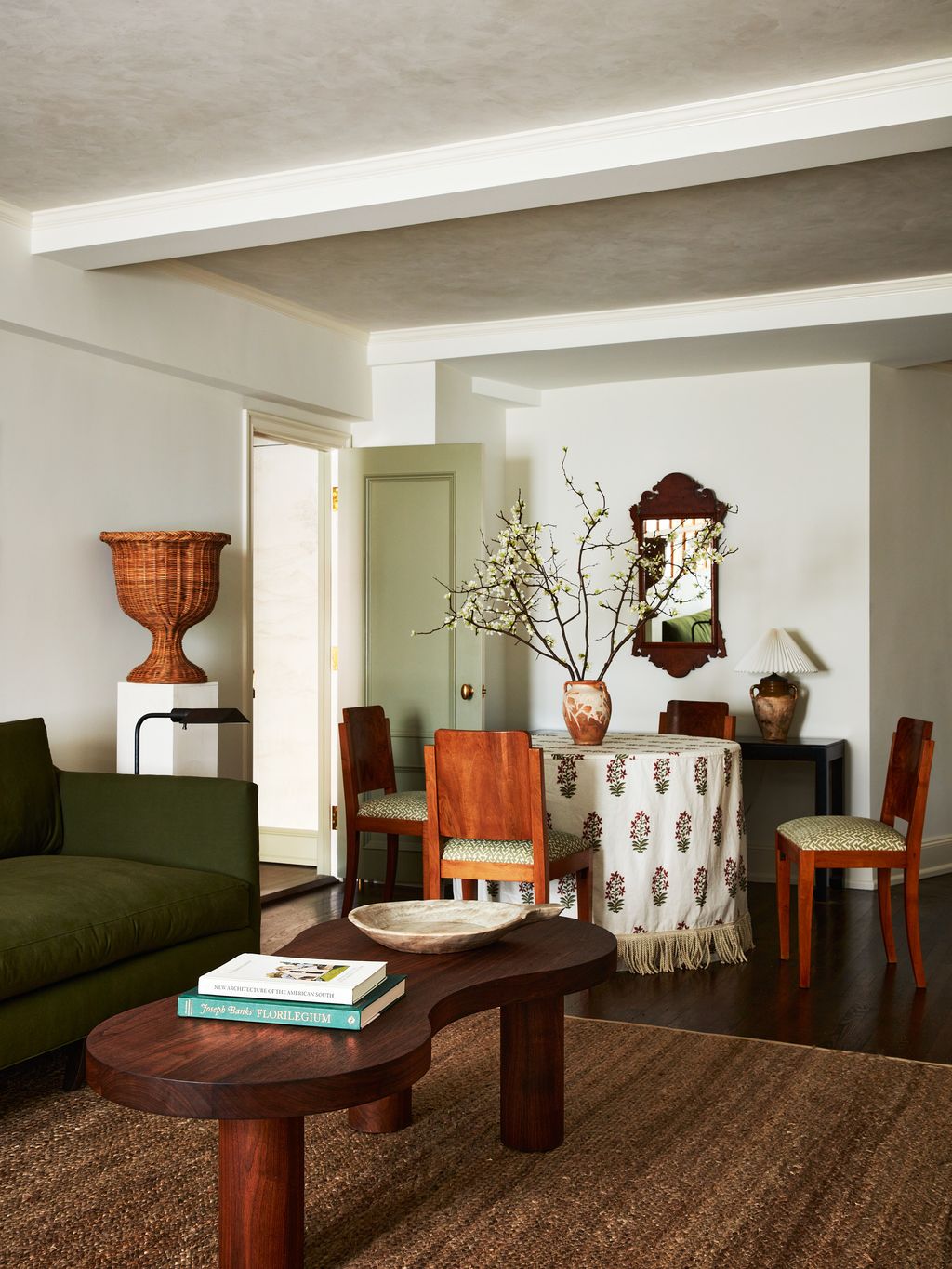 Image may contain Living Room Indoors Room Flooring Interior Design Wood Hardwood Furniture Couch Floor and Table