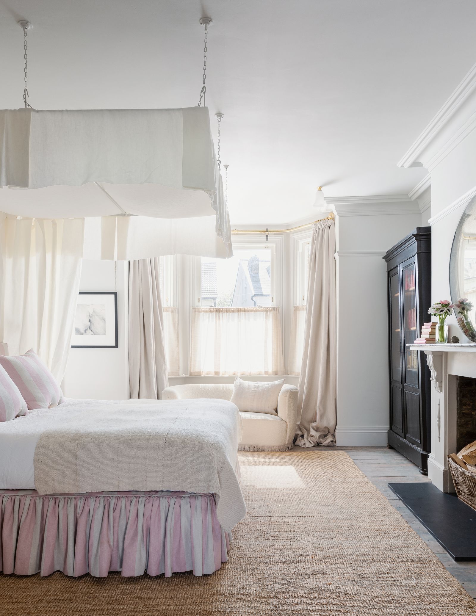 Image may contain Interior Design Indoors Furniture Room Bedroom Living Room Bed Cushion and Home Decor