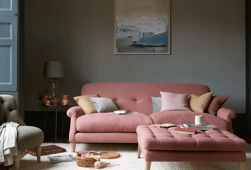 Image may contain Furniture Living Room Indoors Room Couch Cushion Table Coffee Table Pillow and Interior Design