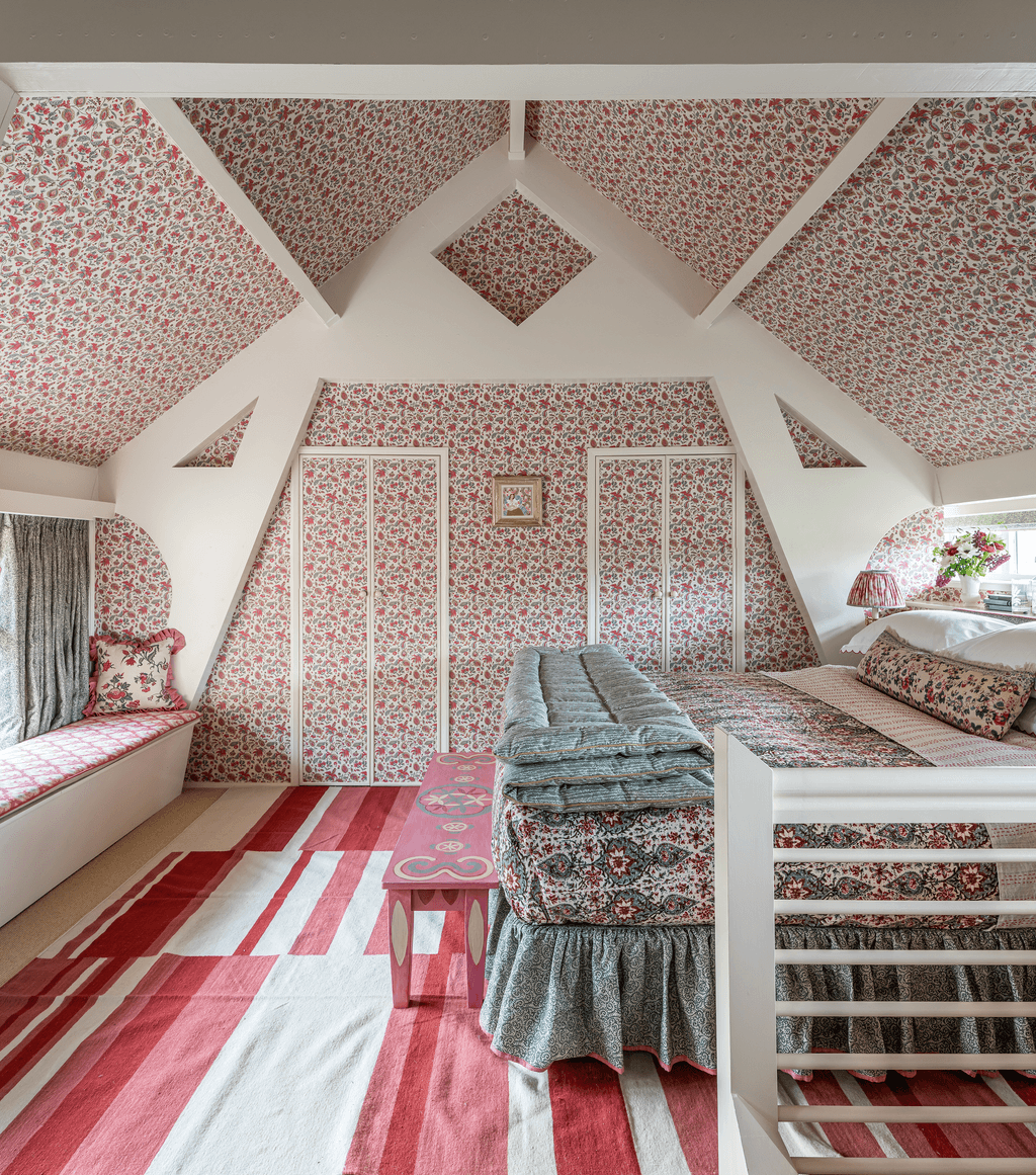 Image may contain Housing Building Indoors Living Room Room Loft Bedroom Flooring Attic Interior Design and Rug