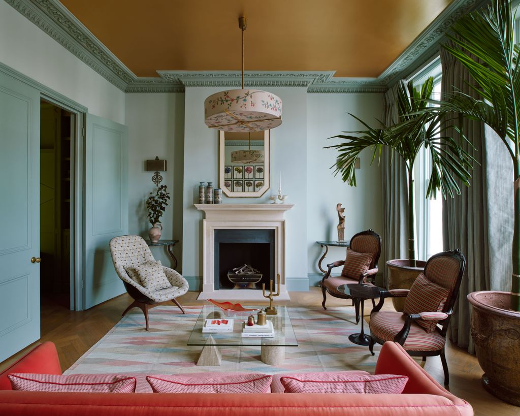 Image may contain Living Room Room Indoors Interior Design Furniture Chair Flooring Fireplace Hearth and Home Decor