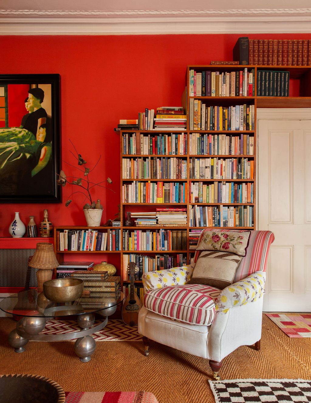 Image may contain Furniture Bookcase Living Room Room Indoors Shelf Interior Design Couch and Rug