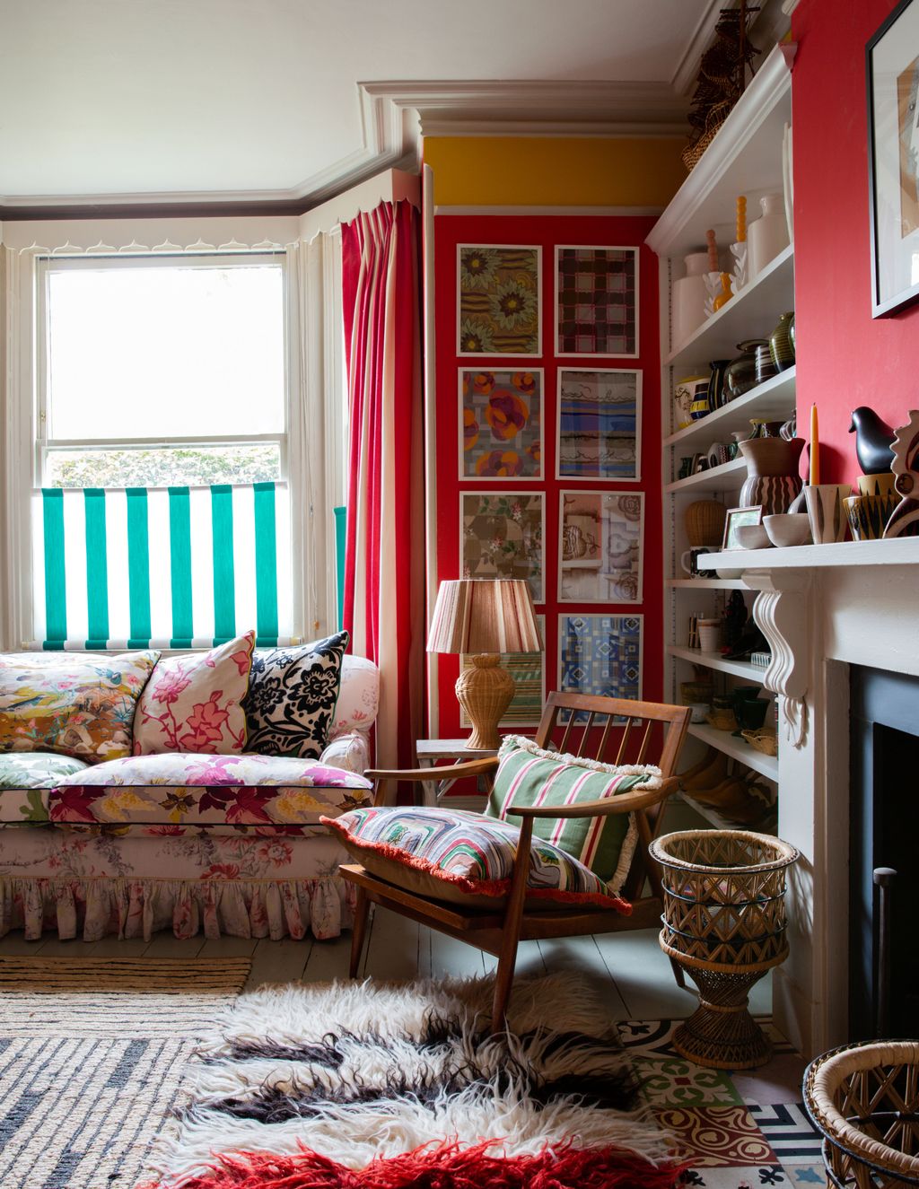 Image may contain Living Room Room Indoors Interior Design Furniture Home Decor Rug Cushion Couch and Shelf