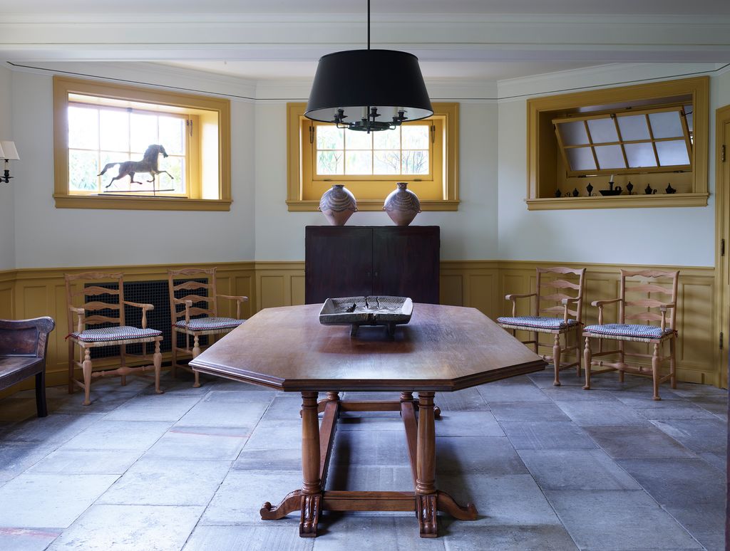 Image may contain Flooring Floor Furniture Room Indoors Wood Hardwood Living Room Interior Design and Table