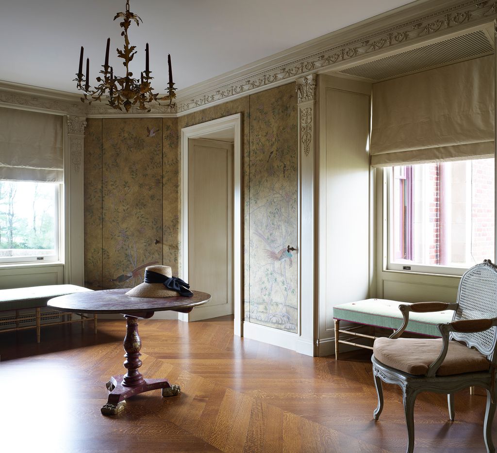 Image may contain Flooring Wood Floor Hardwood Furniture Living Room Room Indoors and Couch