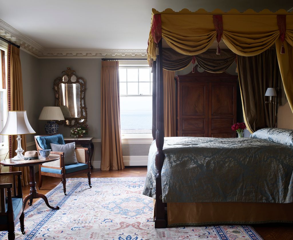 Image may contain Room Bedroom Indoors Furniture Living Room Flooring Interior Design Bed Wood and Hardwood