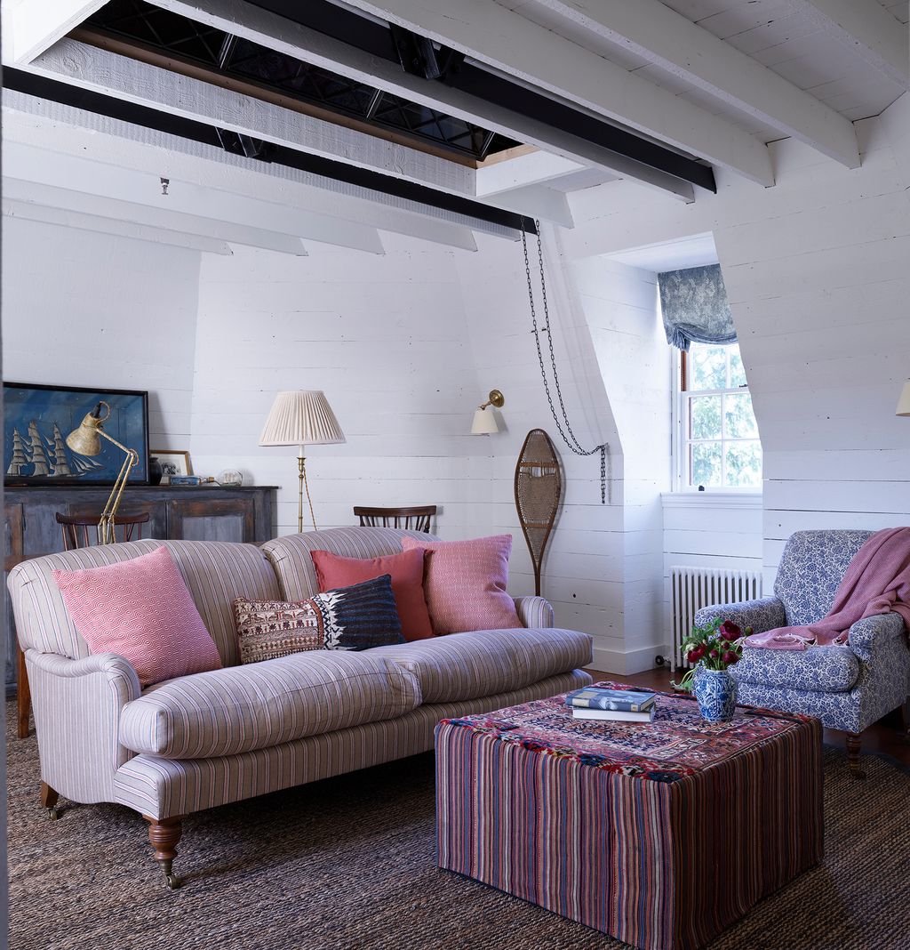 Image may contain Furniture Living Room Indoors Room Couch Table and Rug