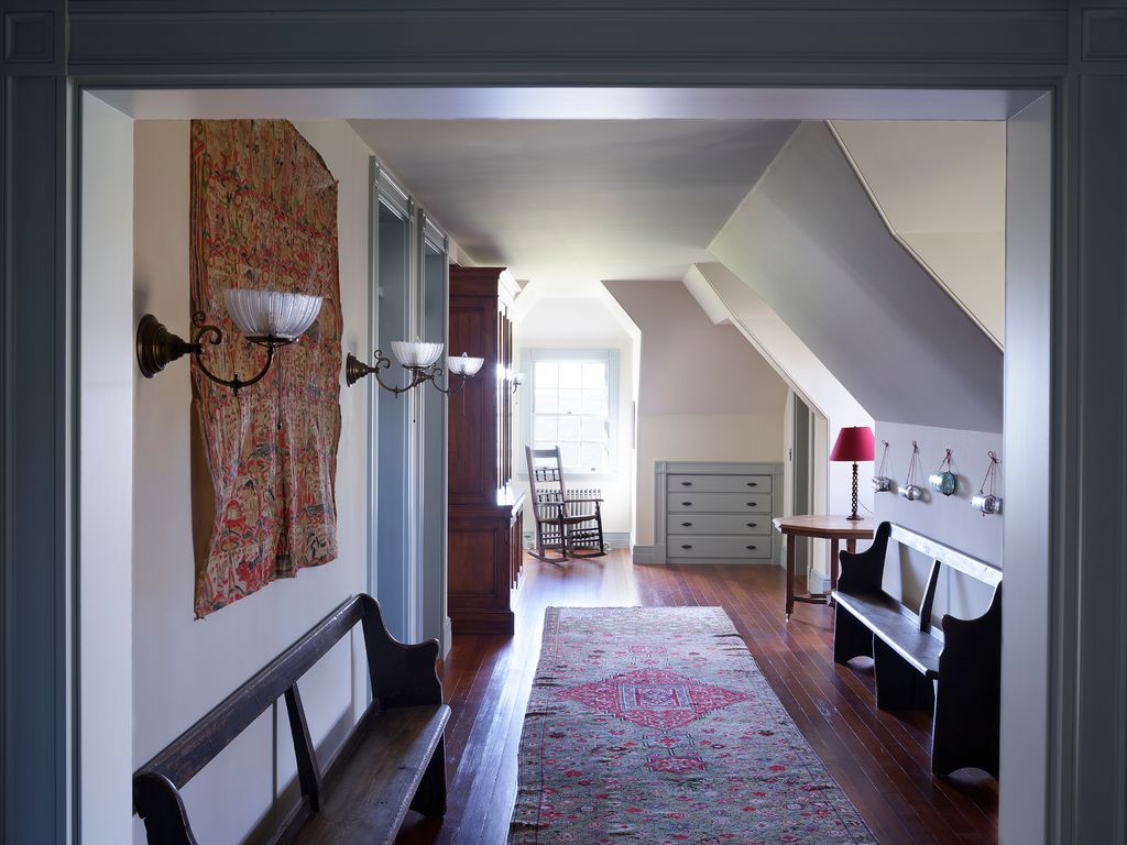 Image may contain Flooring Housing Building Floor Indoors Interior Design Hardwood Wood Loft Living Room and Room