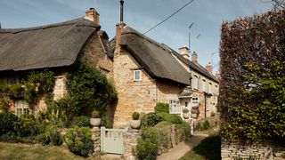 Image may contain Cottage Housing House Building Outdoors Nature Shelter Countryside Rural Roof and Plant