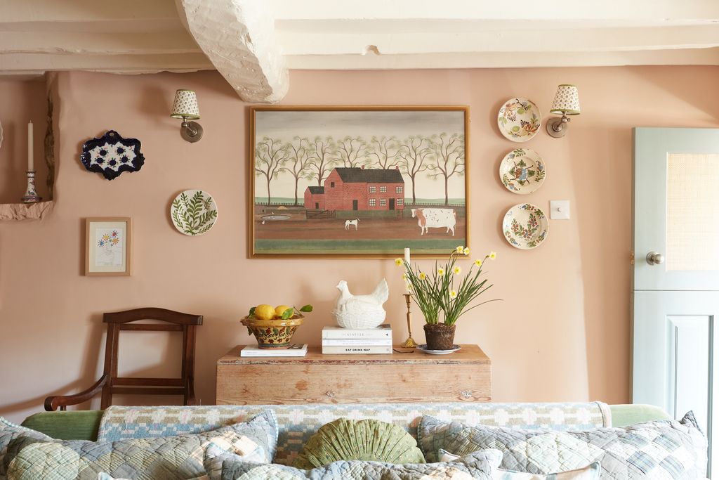 Image may contain Furniture Home Decor Living Room Room Indoors Cushion Pillow and Plant