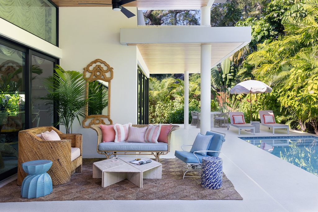 Image may contain Furniture Living Room Room Indoors Table Interior Design Couch Coffee Table Patio and Cushion