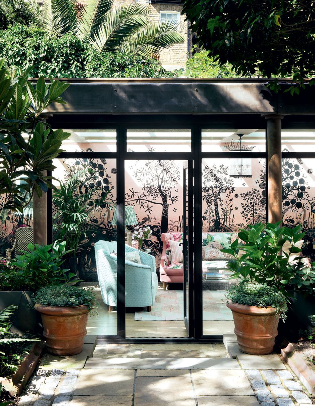 Image may contain Patio Outdoors Garden Flagstone Arbour Vase Plant Pottery Potted Plant and Jar