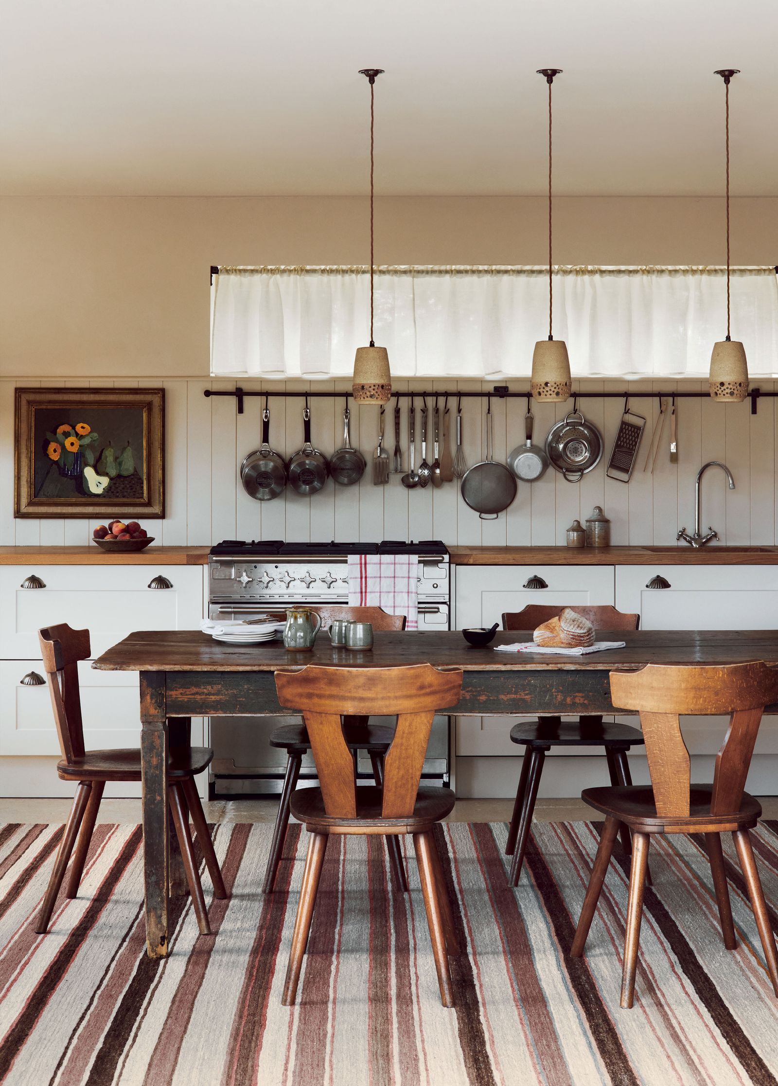 Image may contain Room Indoors Furniture Chair Wood Hardwood Dining Table Table Dining Room and Flooring