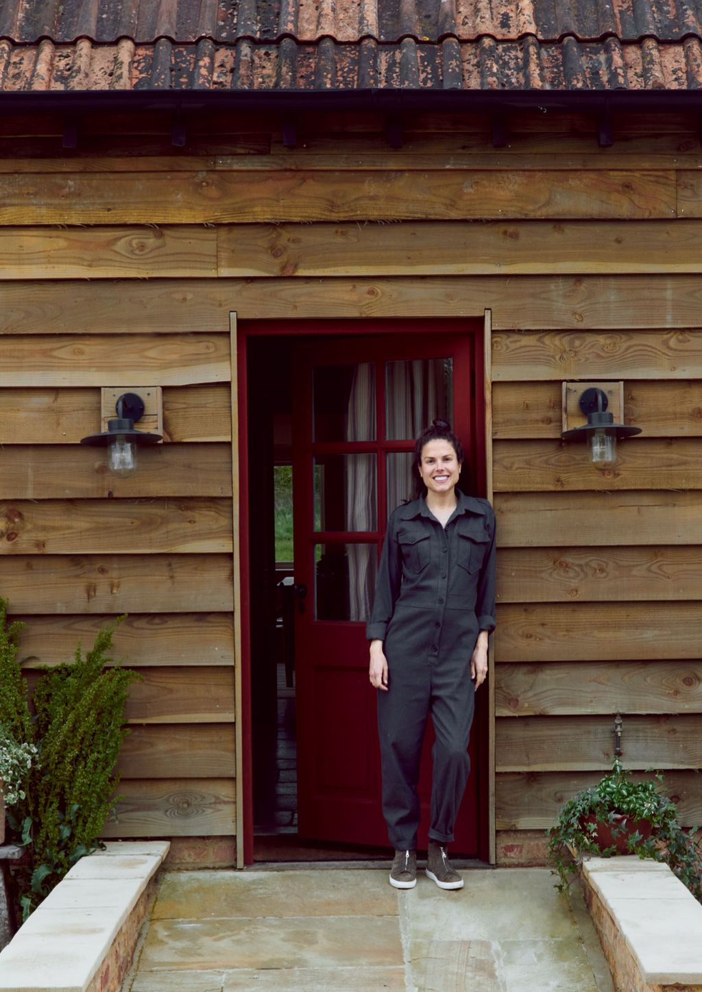 Image may contain Door Clothing Apparel Shoe Footwear Human Person Coat Overcoat Suit and Outdoors