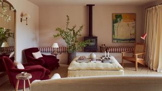 Image may contain Living Room Room Indoors Interior Design Furniture Home Decor Couch and Rug