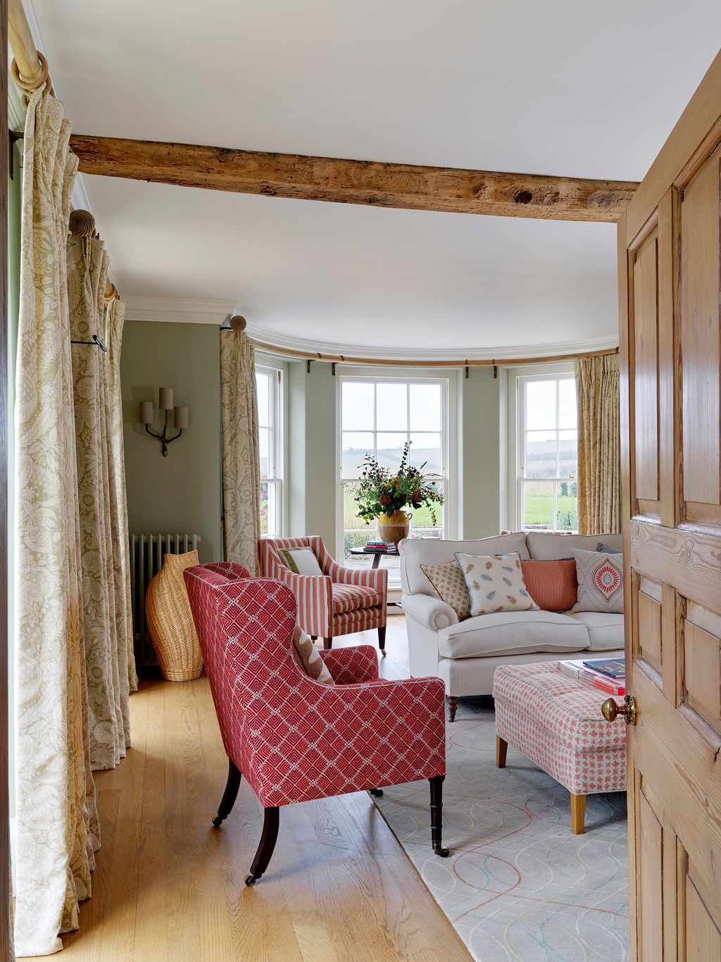 Image may contain Living Room Room Indoors Furniture Couch Wood Interior Design Chair Home Decor and Flooring