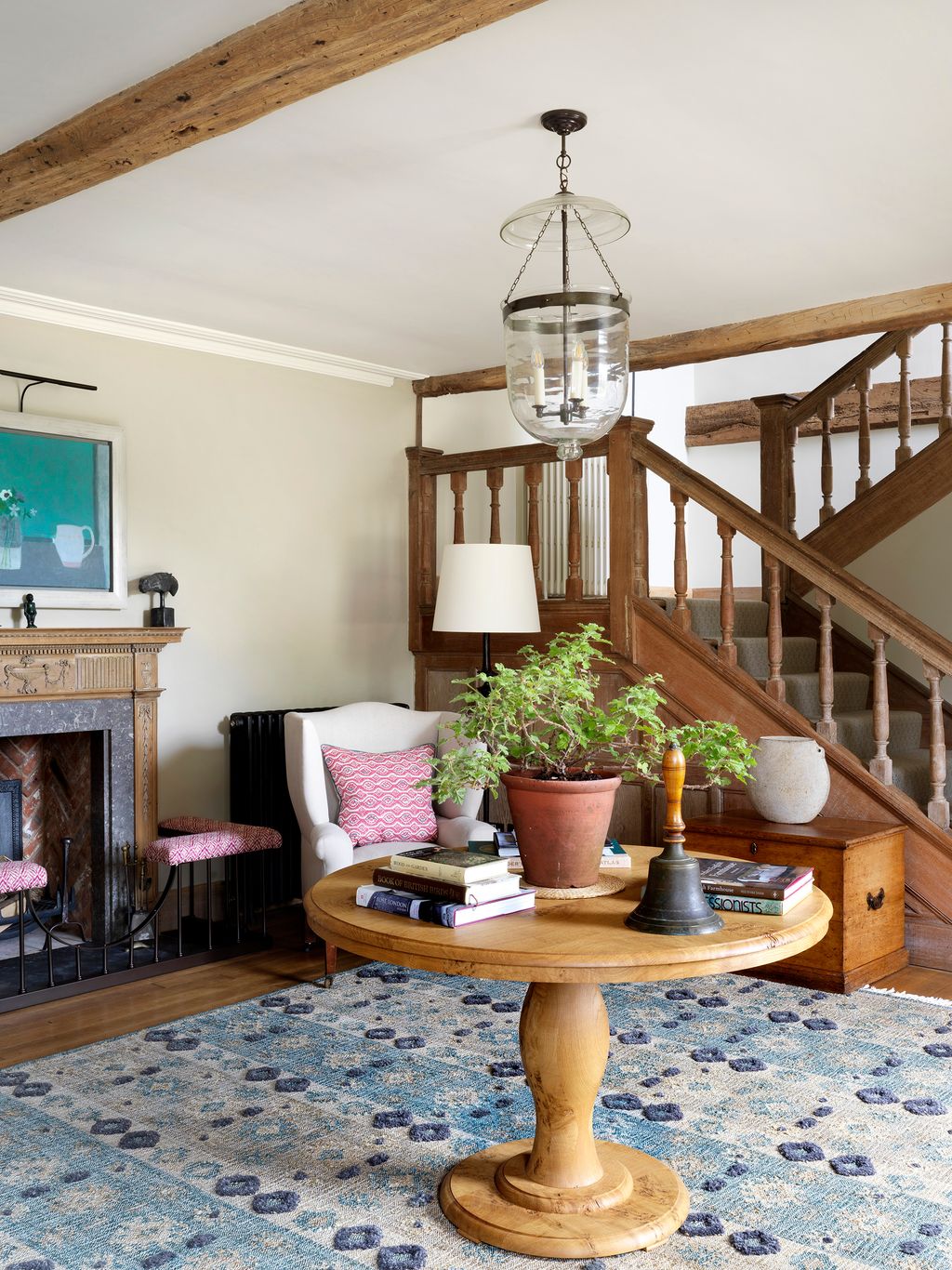 Image may contain Living Room Room Indoors Furniture Interior Design Wood Table Rug and Hardwood