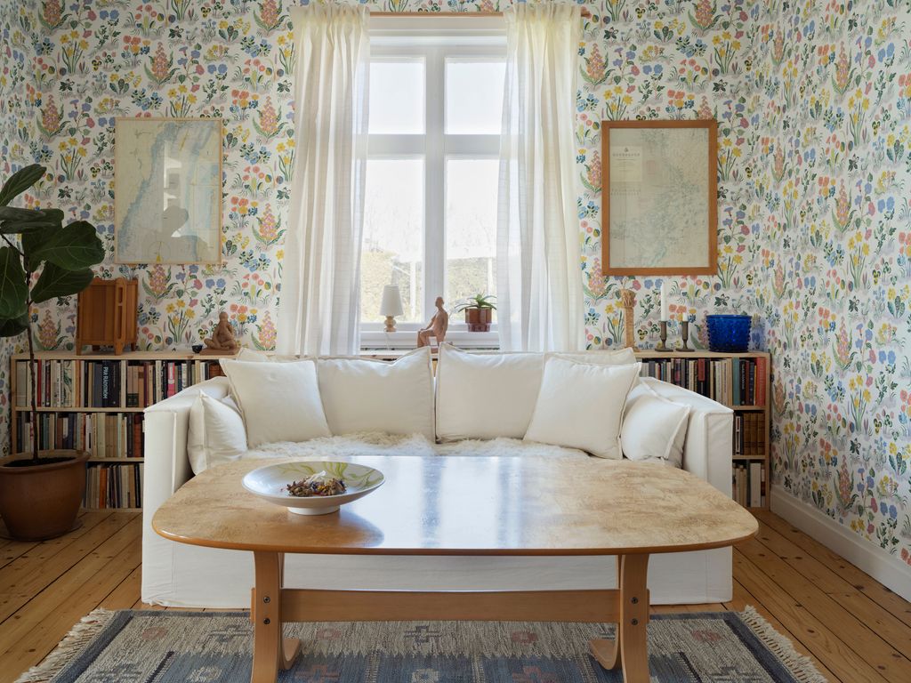 Image may contain Furniture Table Coffee Table Living Room Indoors Room and Couch