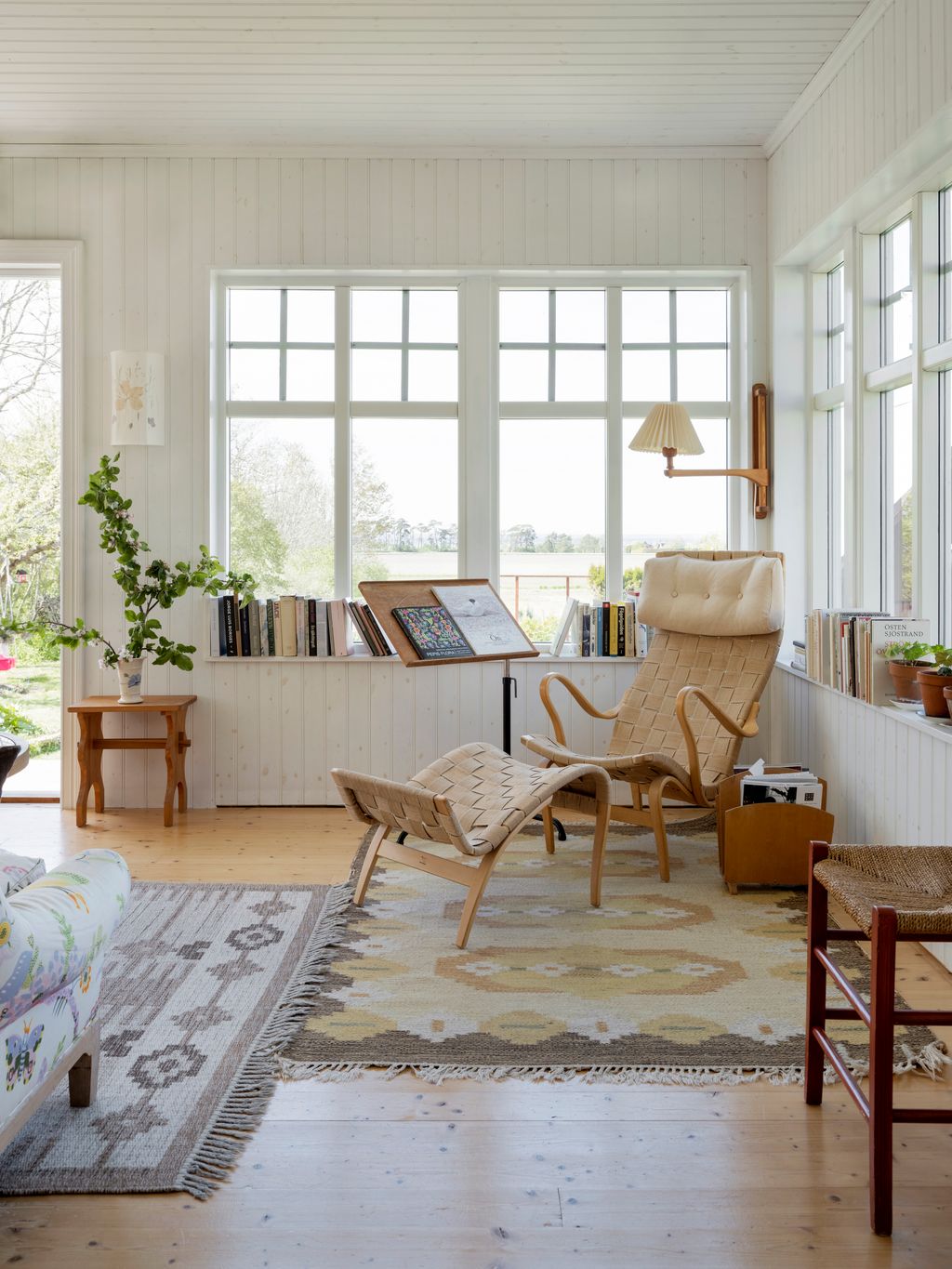 Image may contain Living Room Room Indoors Furniture Rug Interior Design and Wood