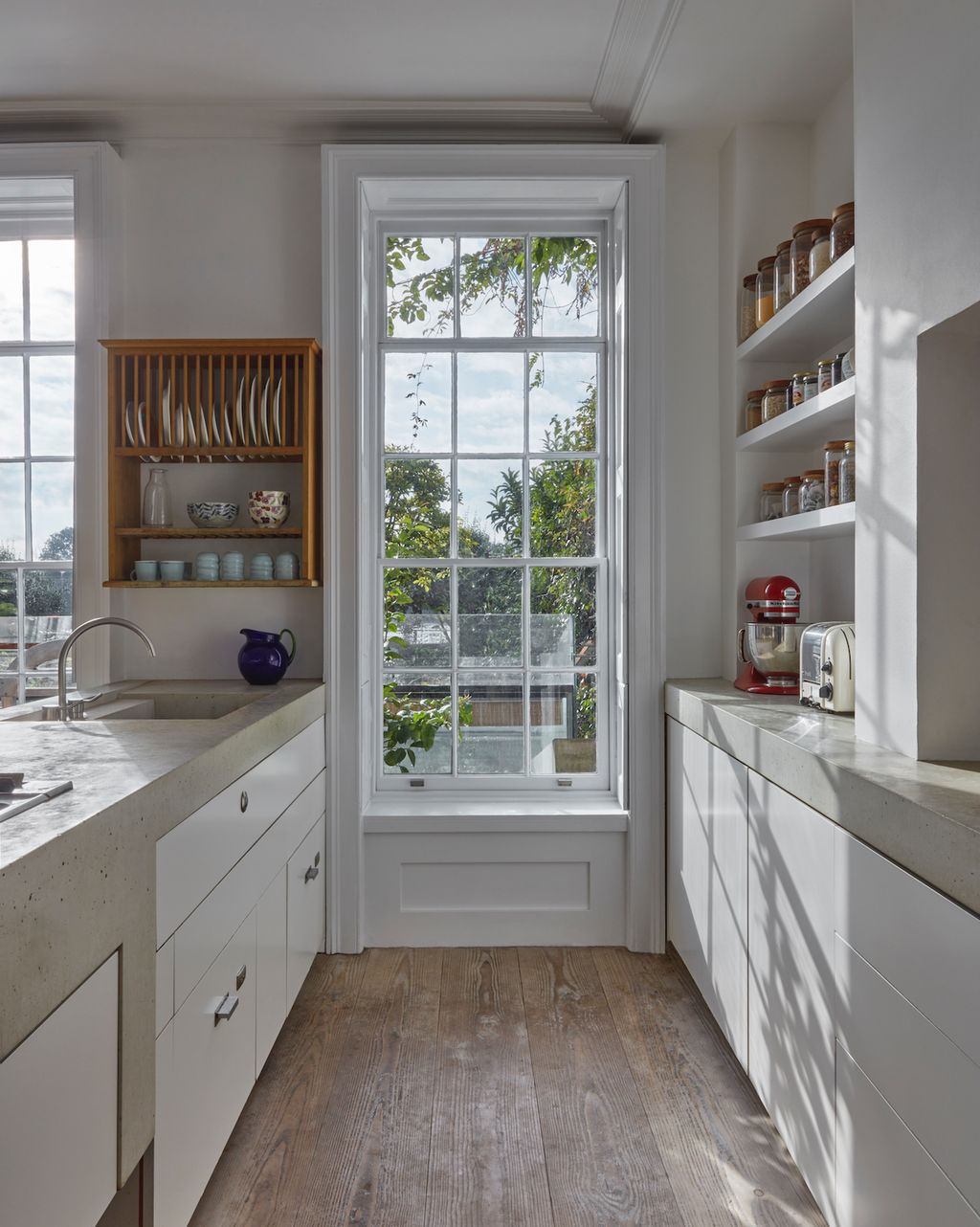 Image may contain Indoors Room Shelf and Kitchen