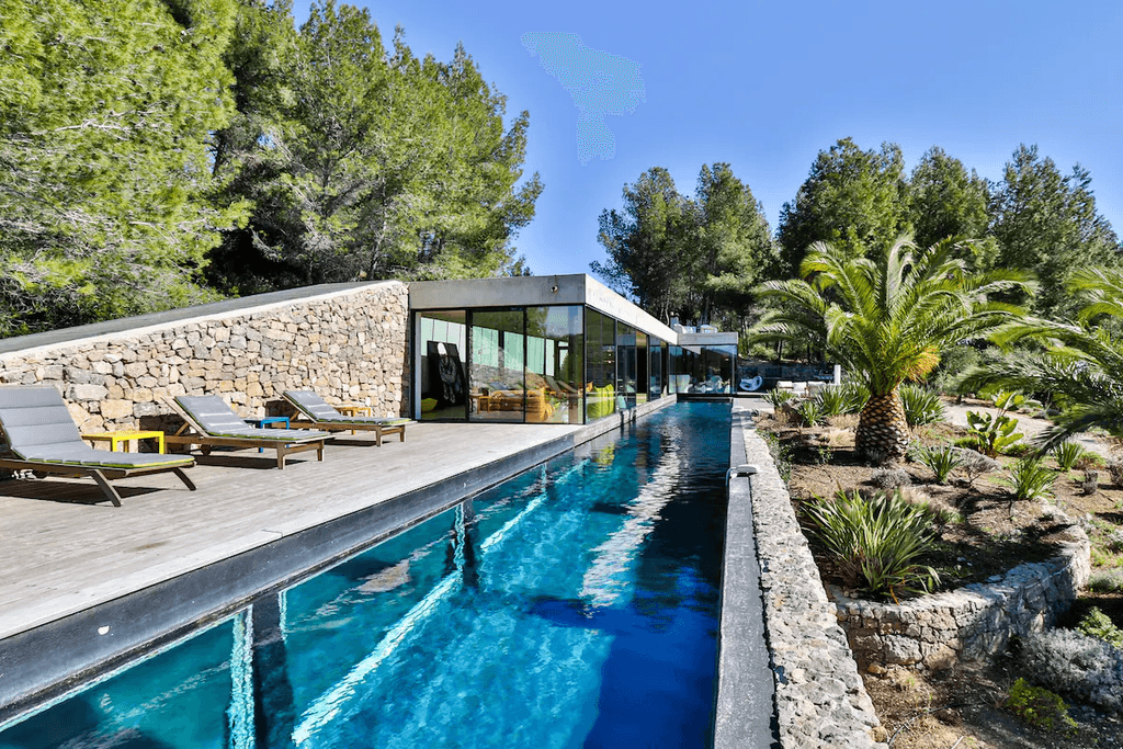 Image may contain Pool Water Housing Villa House Building Swimming Pool and Plant