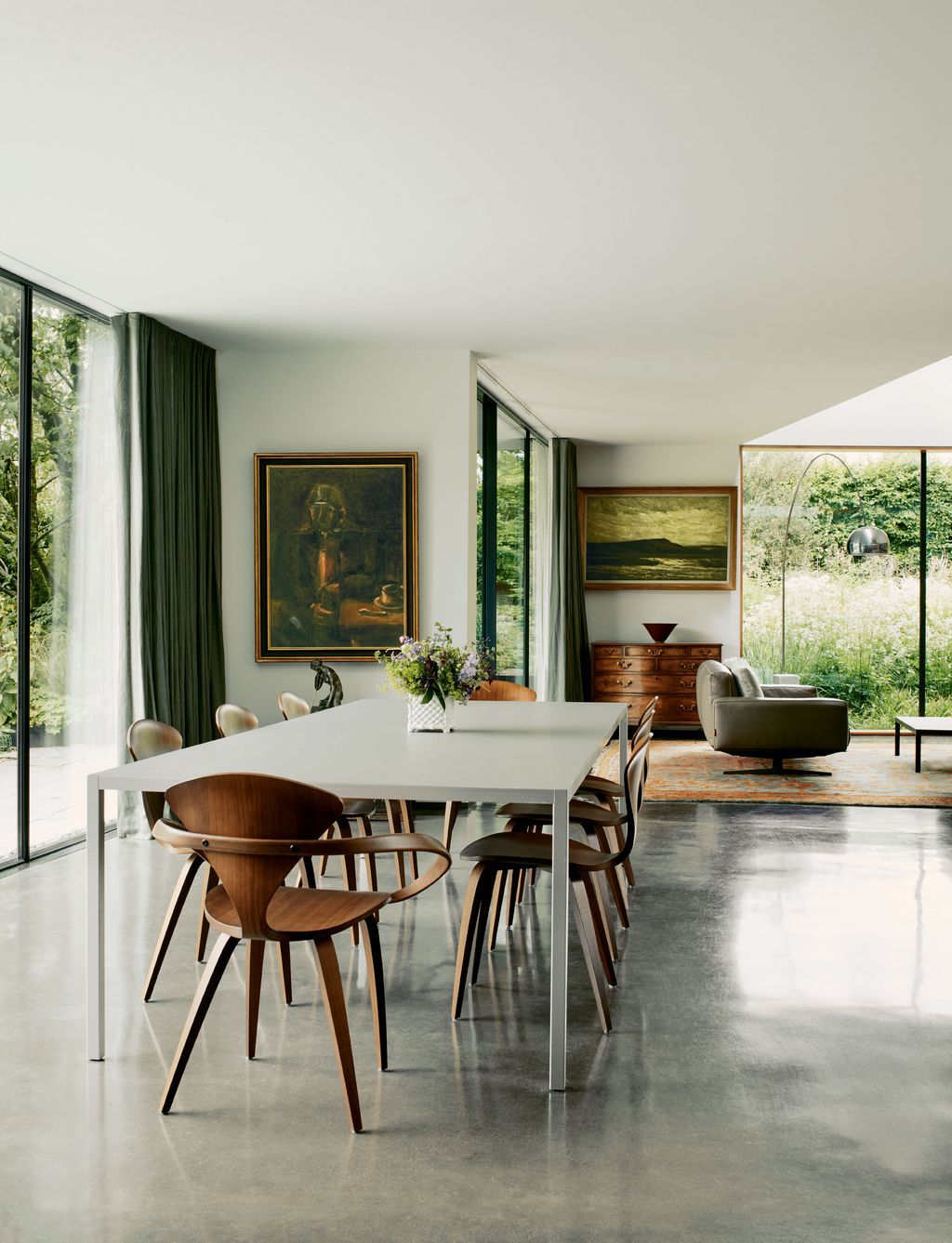 Image may contain Furniture Chair Flooring Indoors Room Interior Design Dining Room Table and Living Room