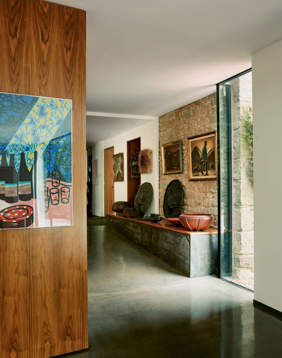 A polished concrete ramp leads from the main house into the kitchendining area of the extension.