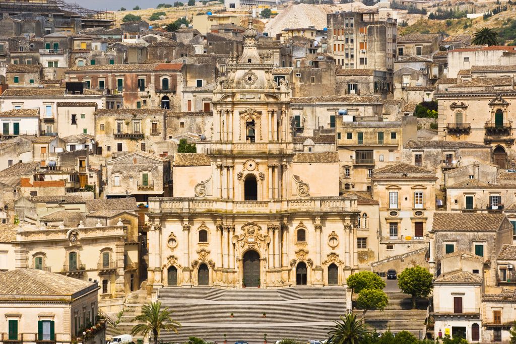 Image may contain City Urban Town Building Downtown Architecture Housing Monastery Metropolis Water and Scenery