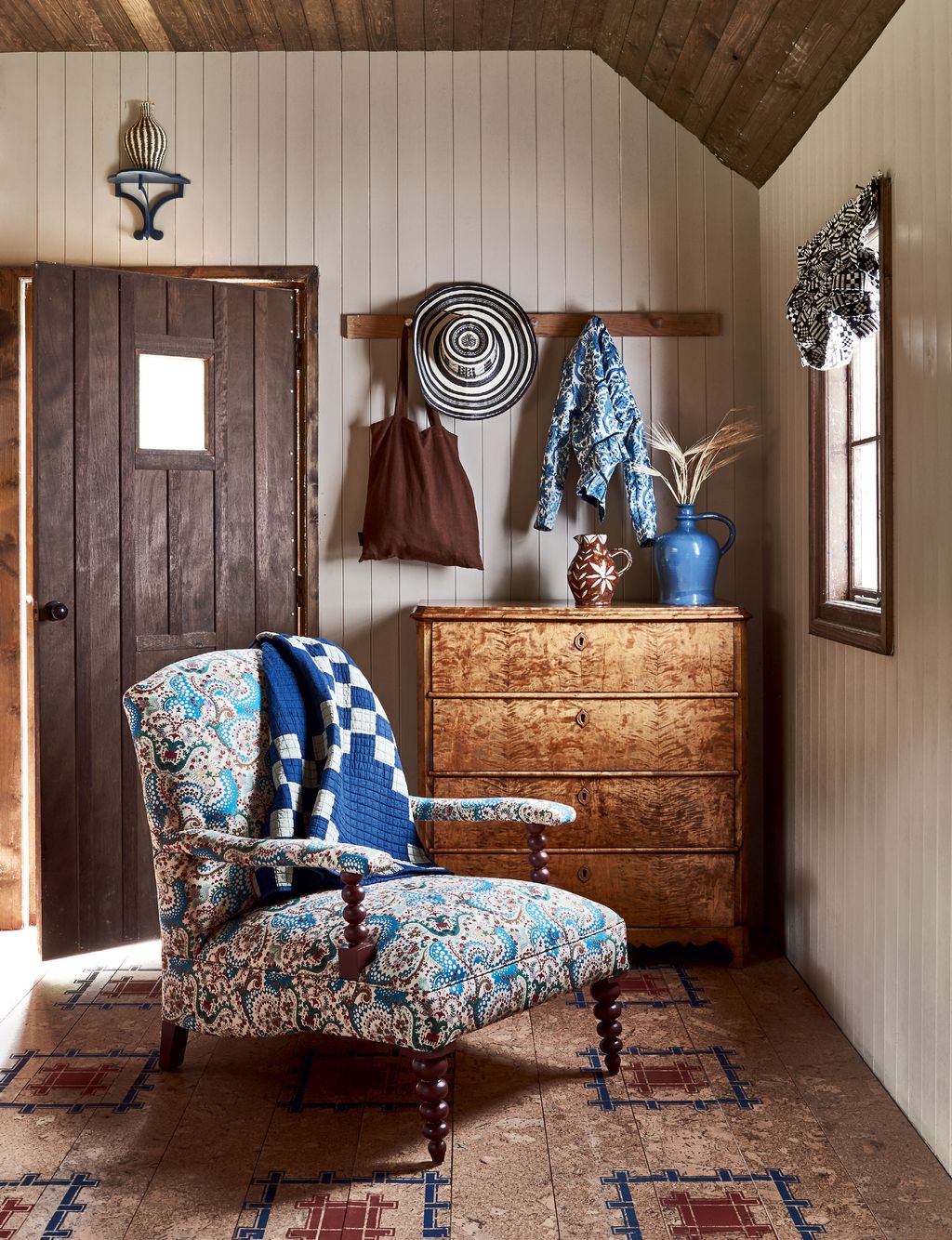 Image may contain Furniture Wood Chair Indoors Interior Design Flooring Home Decor Hardwood Living Room and Room