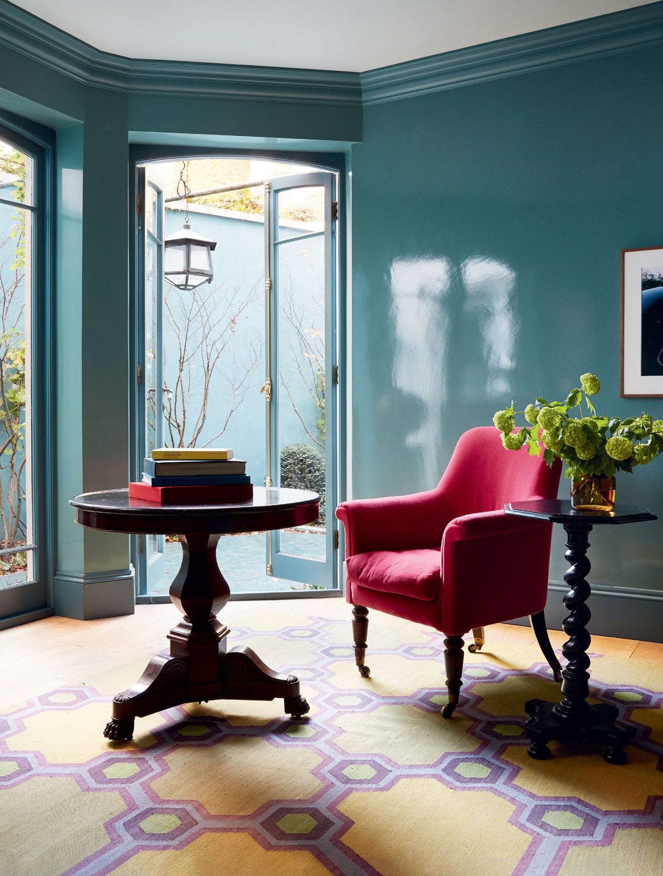 Image may contain Furniture Indoors Interior Design Living Room Room Chair Home Decor Table Plant Couch and Rug